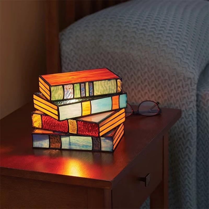 Lamp made of stacked books from stained glass by Bowlift