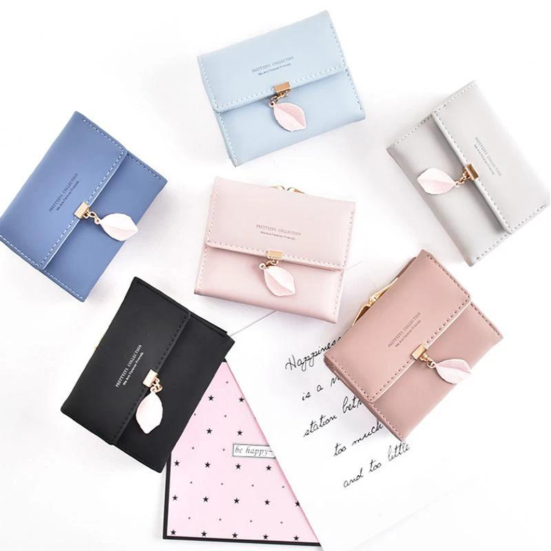 Short wallet with three folds and leaf decor by Bowlift