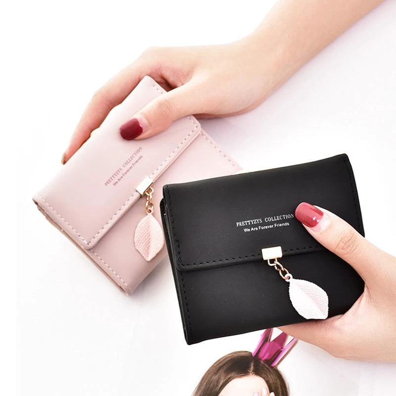 Short wallet with three folds and leaf decor by Bowlift