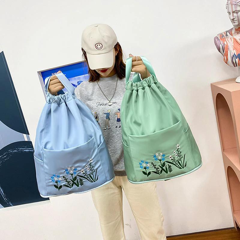 Multifunctional travel backpack with drawstring and embroidery by Bowlift