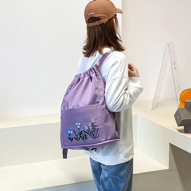 Multifunctional travel backpack with drawstring and embroidery by Bowlift