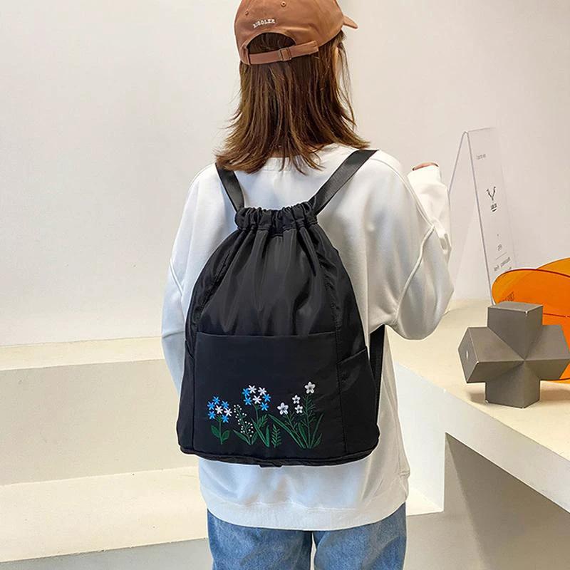 Multifunctional travel backpack with drawstring and embroidery by Bowlift