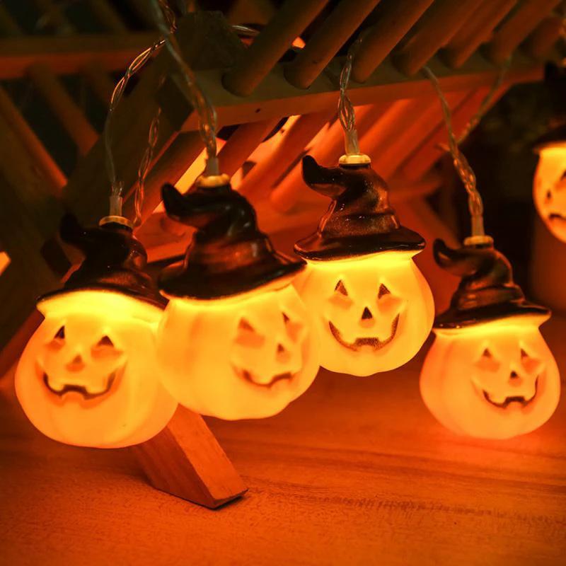 Glowing pumpkin garland Halloween with witch hats by Bowlift