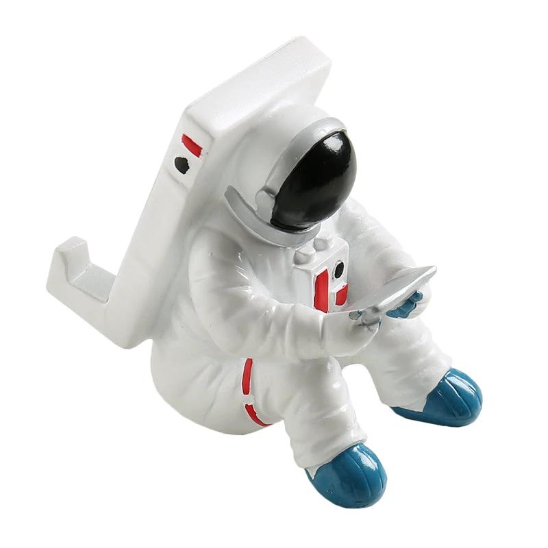 Support for phones or pens in astronaut decorations by Bowlift