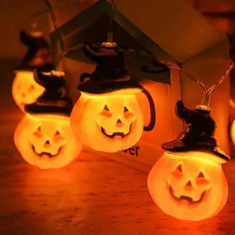 Glowing pumpkin garland Halloween with witch hats by Bowlift