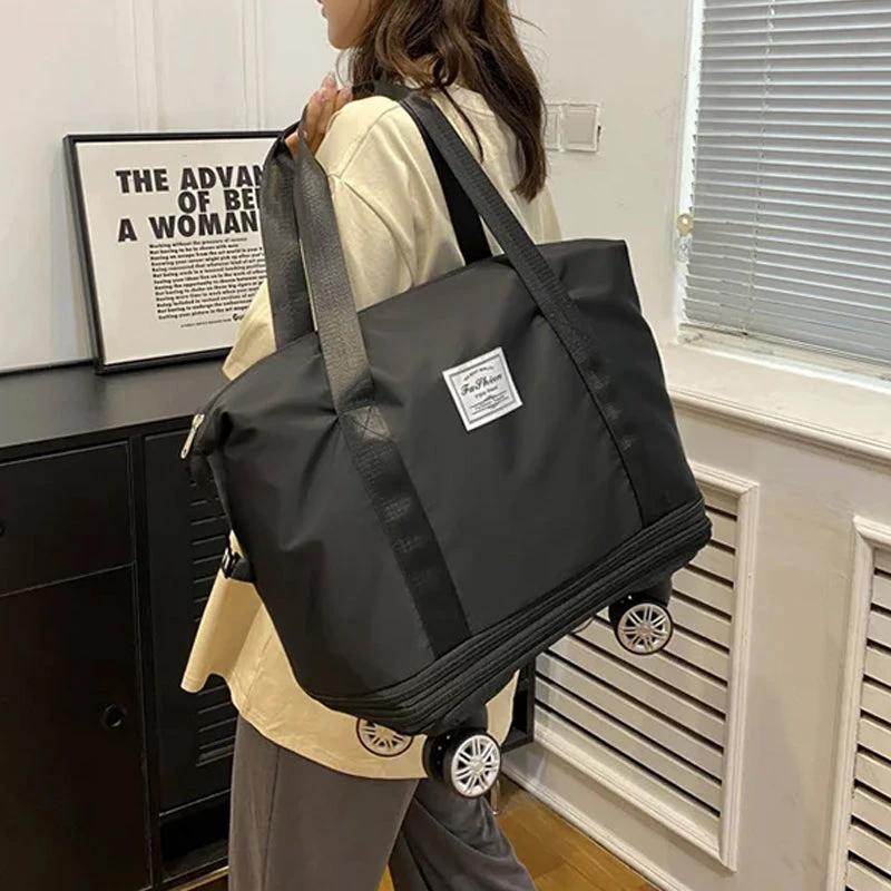 Travel bag with universal wheels by Bowlift