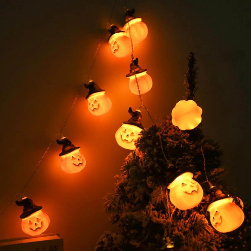 Glowing pumpkin garland Halloween with witch hats by Bowlift