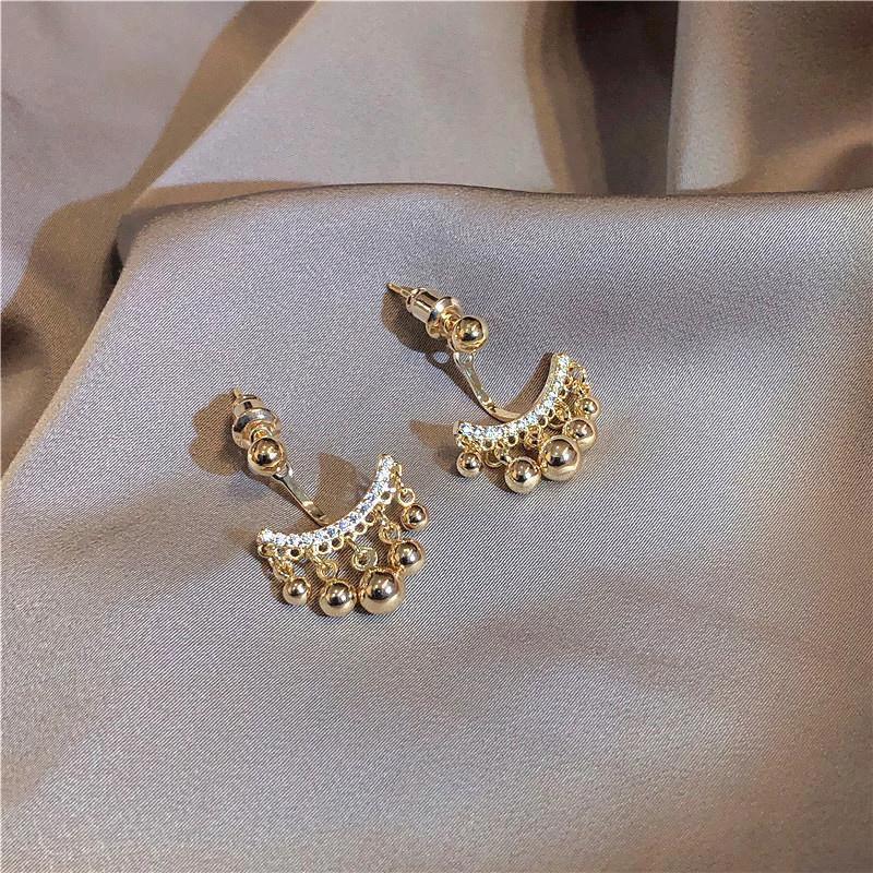 Geometric Meniscus Earrings made of Rhinestones and Pearls by Bowlift