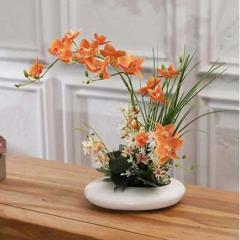 Lifelike flower arrangement in a modern vase Bowlift by Bowlift