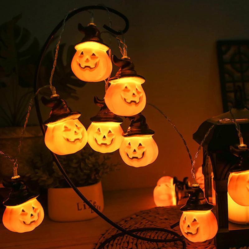 Glowing pumpkin garland Halloween with witch hats by Bowlift