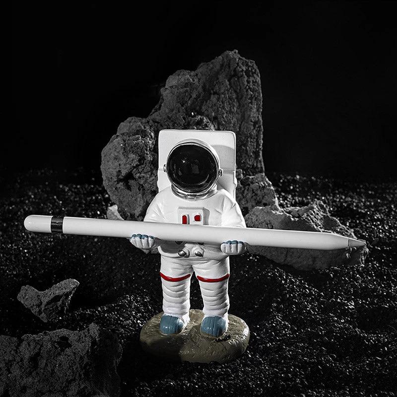 Support for phones or pens in astronaut decorations by Bowlift