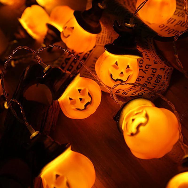 Glowing pumpkin garland Halloween with witch hats by Bowlift