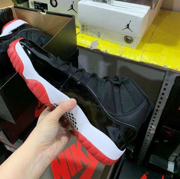 Air Jordan 11 Bred Black Red by Air Jordan