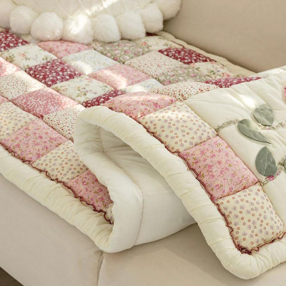 Floral Bloom Quilted Sofa Cover by Casa & Beyond.