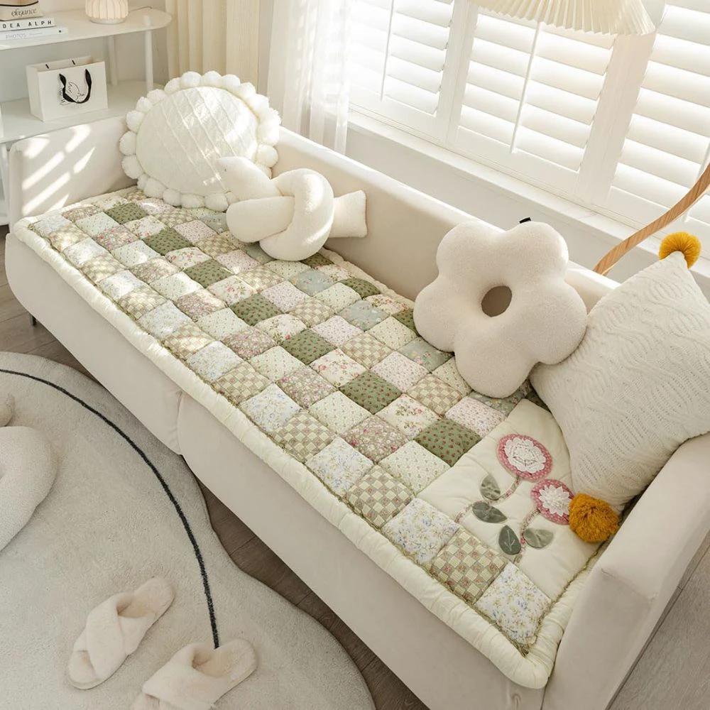 Floral Bloom Quilted Sofa Cover by Casa & Beyond.