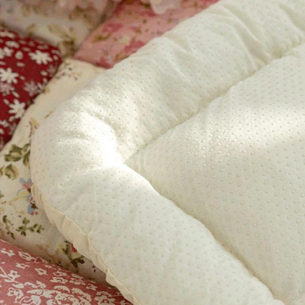 Floral Bloom Quilted Sofa Cover by Casa & Beyond.