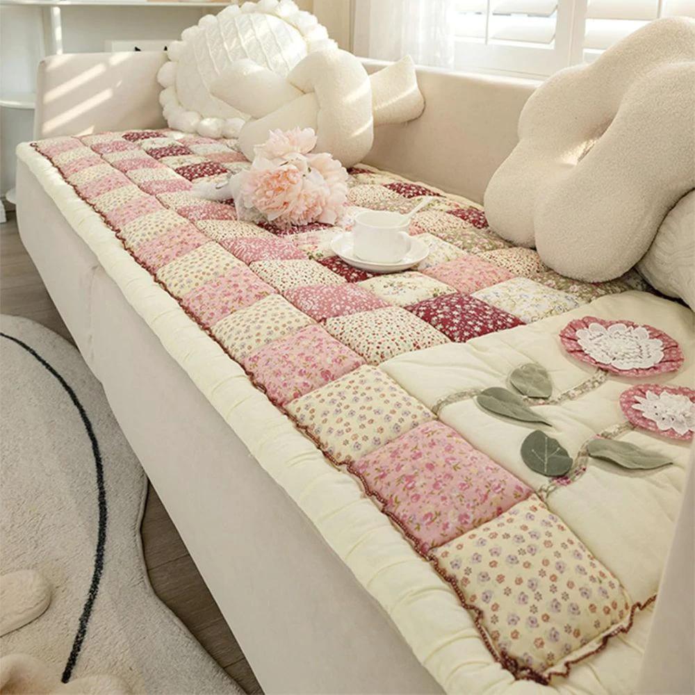 Floral Bloom Quilted Sofa Cover by Casa & Beyond.
