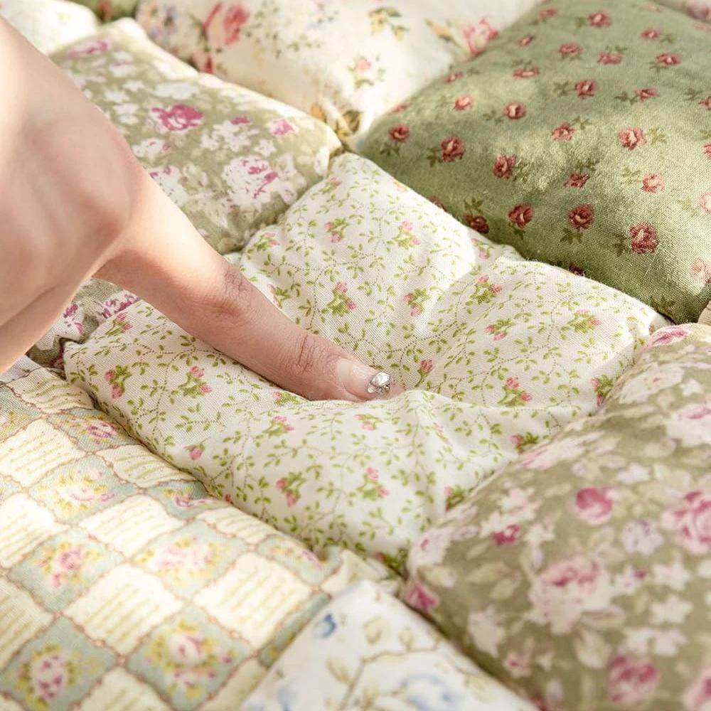 Floral Bloom Quilted Sofa Cover by Casa & Beyond.