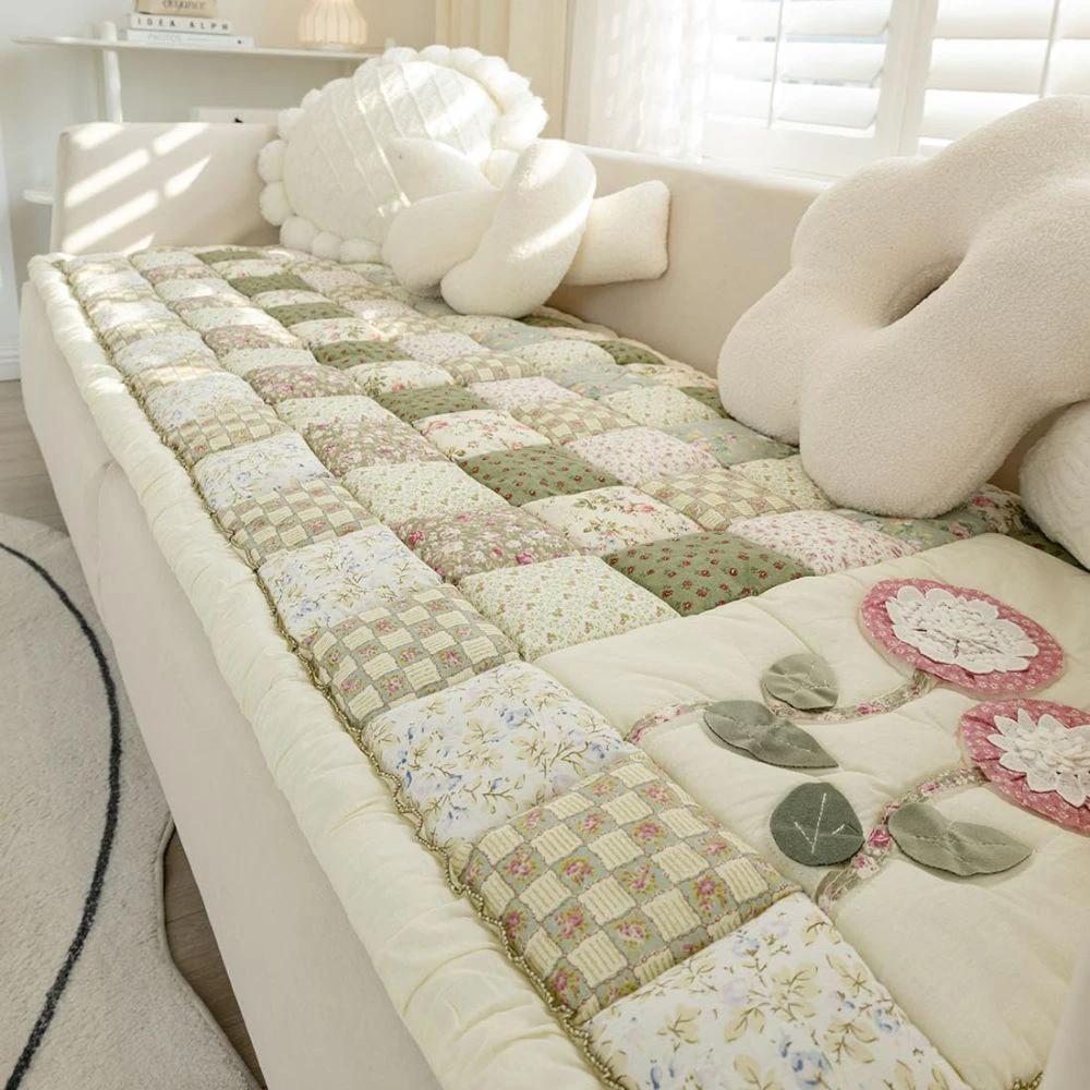 Floral Bloom Quilted Sofa Cover by Casa & Beyond.