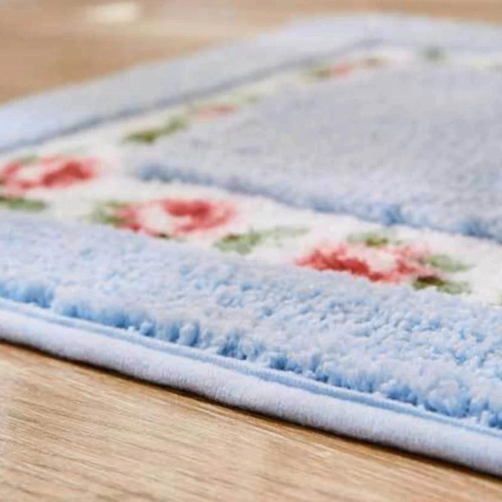 Floral Oval Plush Bath Mat by Casa & Beyond.