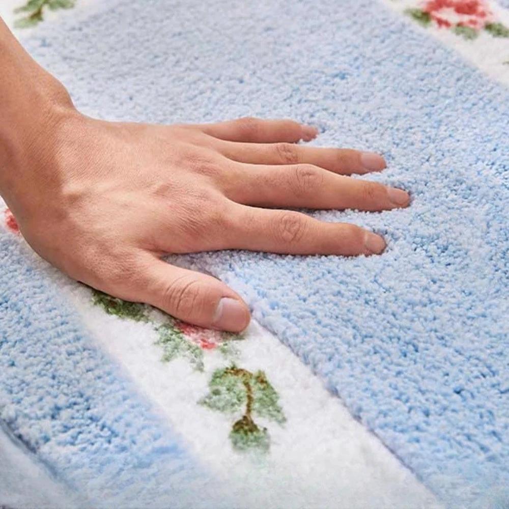 Floral Oval Plush Bath Mat by Casa & Beyond.