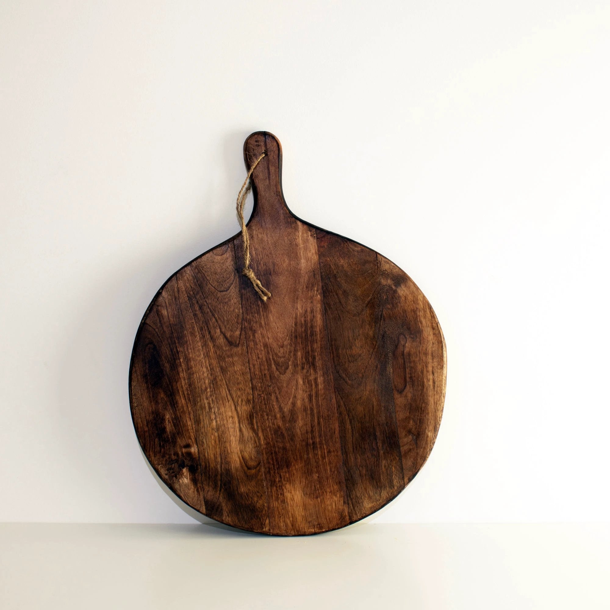Irregular Round Dark Brown Chopping Boards by BowLift