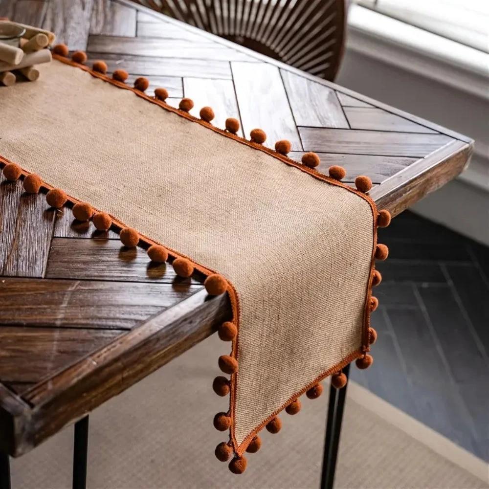 Jute Bohemian Pom-Pom Table Runner by Casa & Beyond