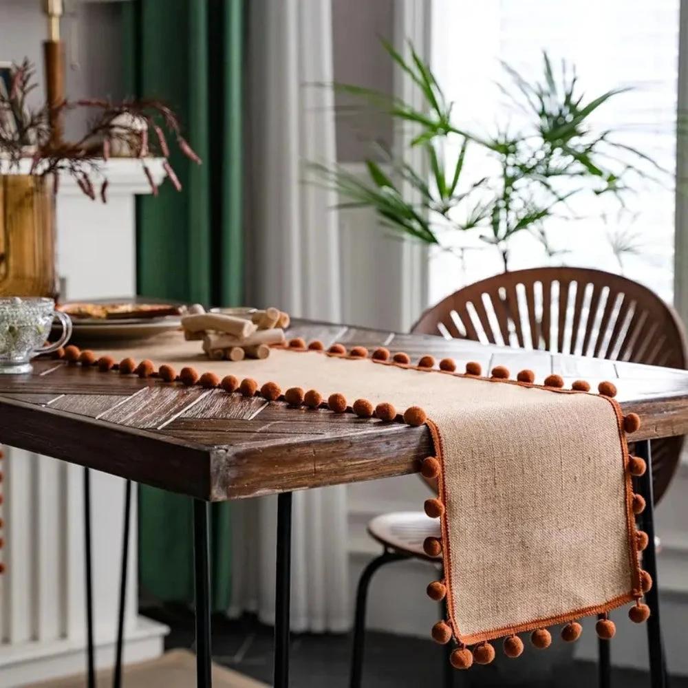 Jute Bohemian Pom-Pom Table Runner by Casa & Beyond