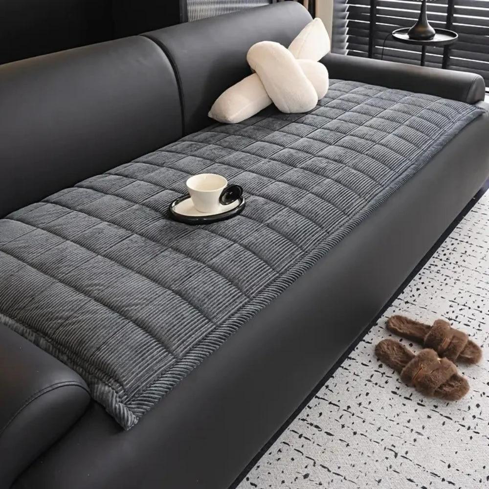 Metro Line Quilted Couch Cover Mat by Casa & Beyond.