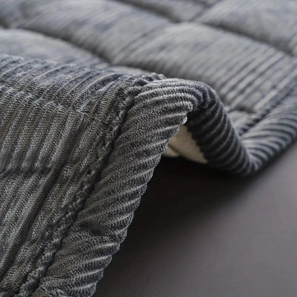 Metro Line Quilted Couch Cover Mat by Casa & Beyond.