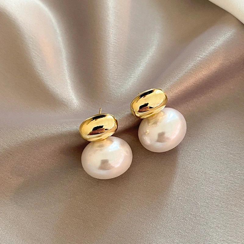 Classy Gold Accented Pearl Stud Earrings by BowLift