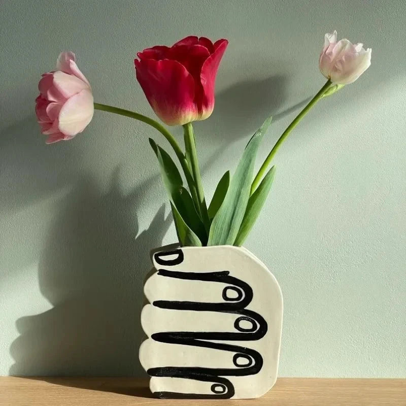 Hand Holding Flowers Vase by Bowlift