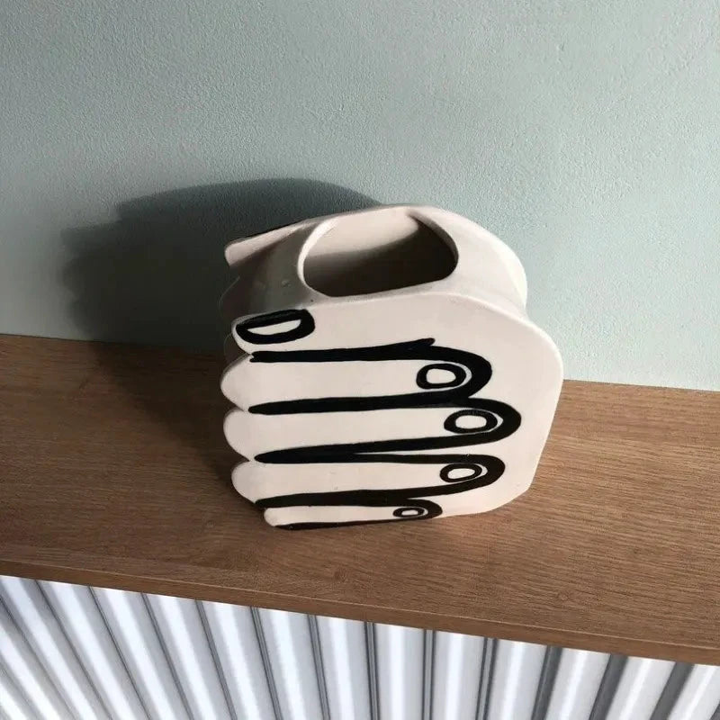Hand Holding Flowers Vase by Bowlift