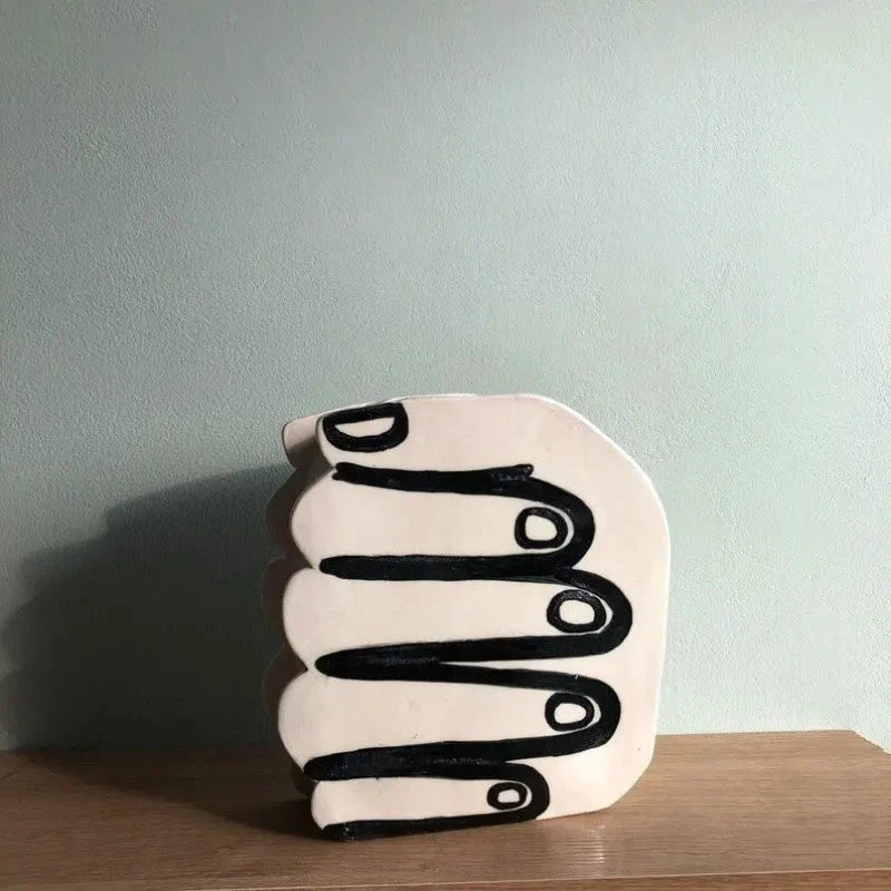 Hand Holding Flowers Vase by Bowlift