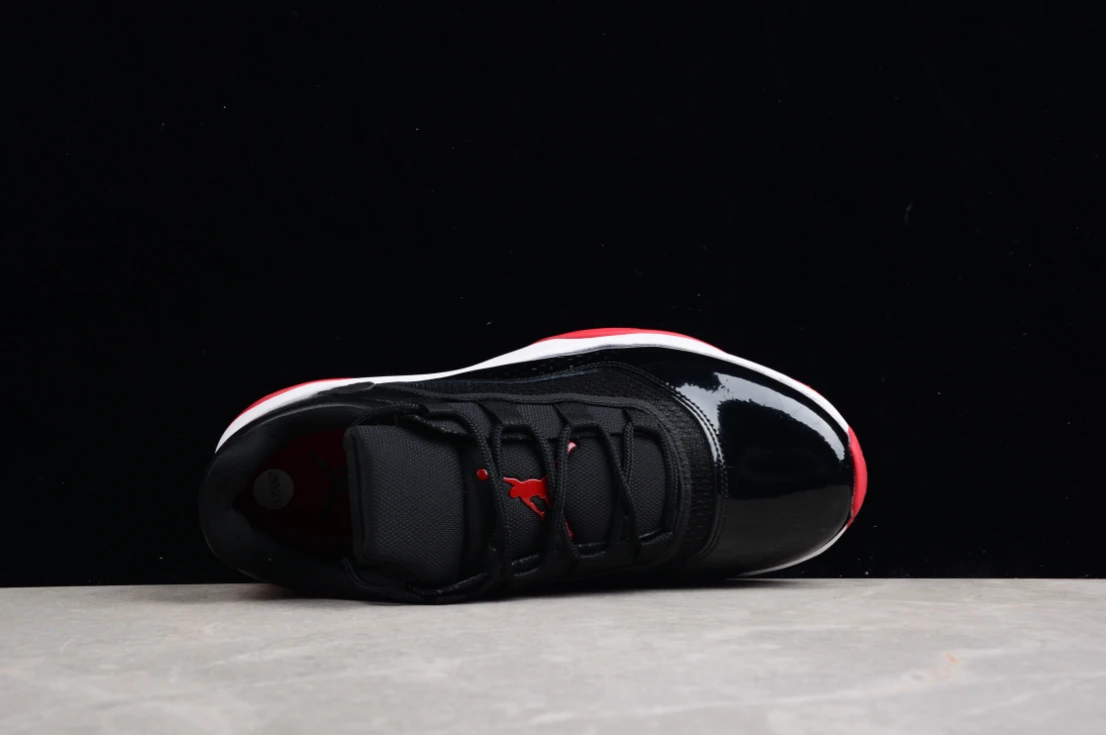 Air Jordan 11 CMFT Low Bred Black Red White by Air Jordan