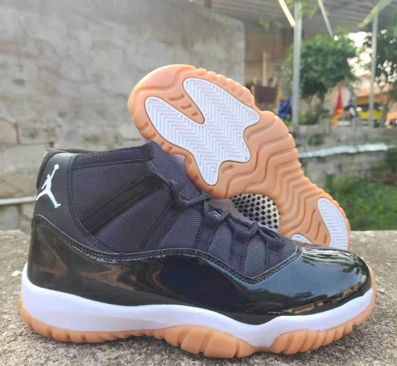 Air Jordan 11 Black Gum Sneakers by Air Jordan