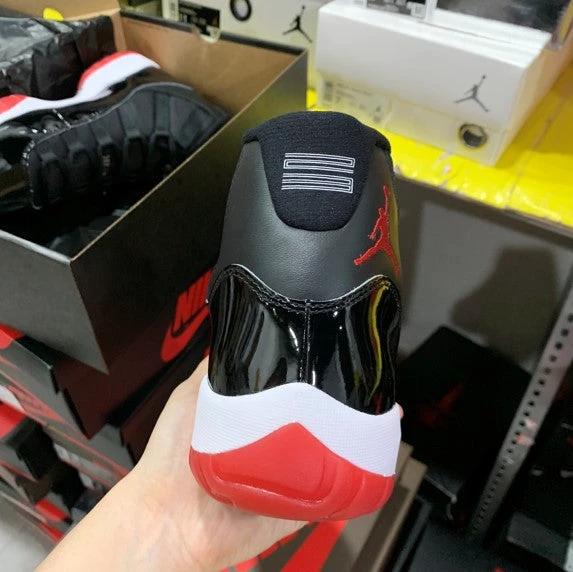 Air Jordan 11 Bred Black Red by Air Jordan