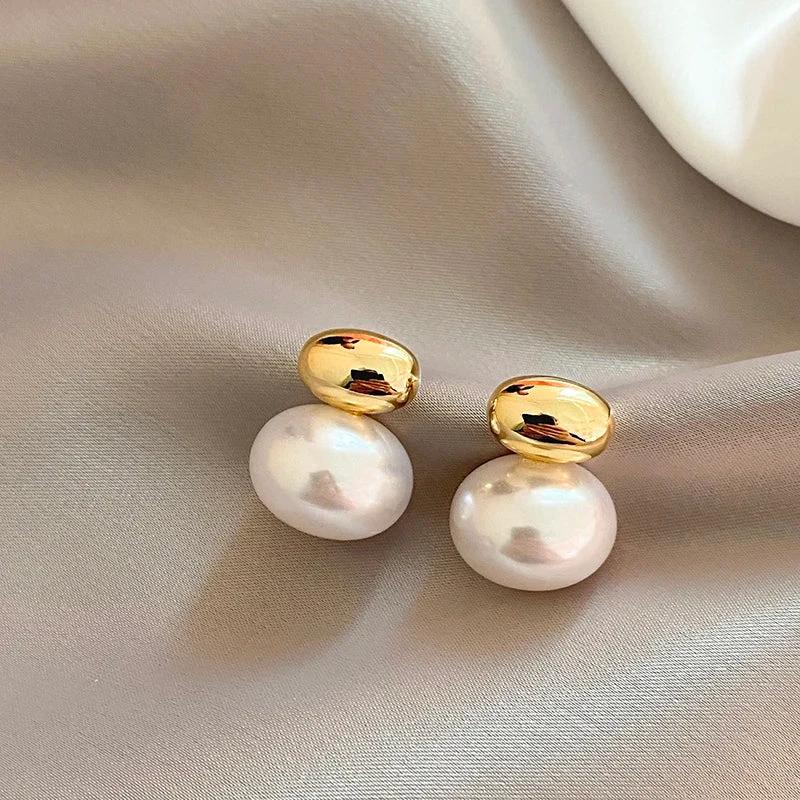 Classy Gold Accented Pearl Stud Earrings by BowLift