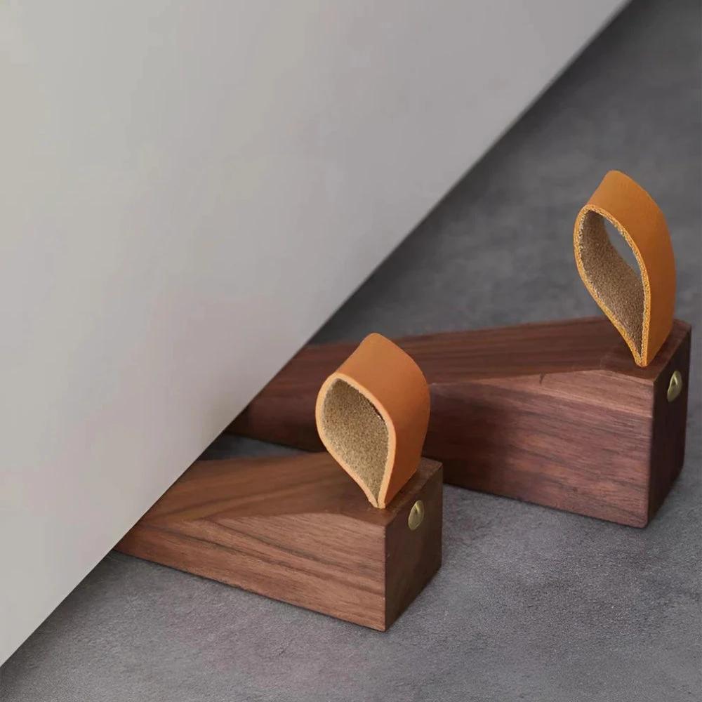 Sleek Wooden Door Stopper by Casa & Beyond.