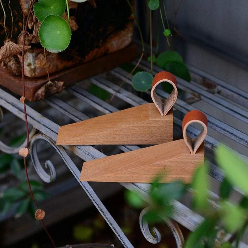 Sleek Wooden Door Stopper by Casa & Beyond.