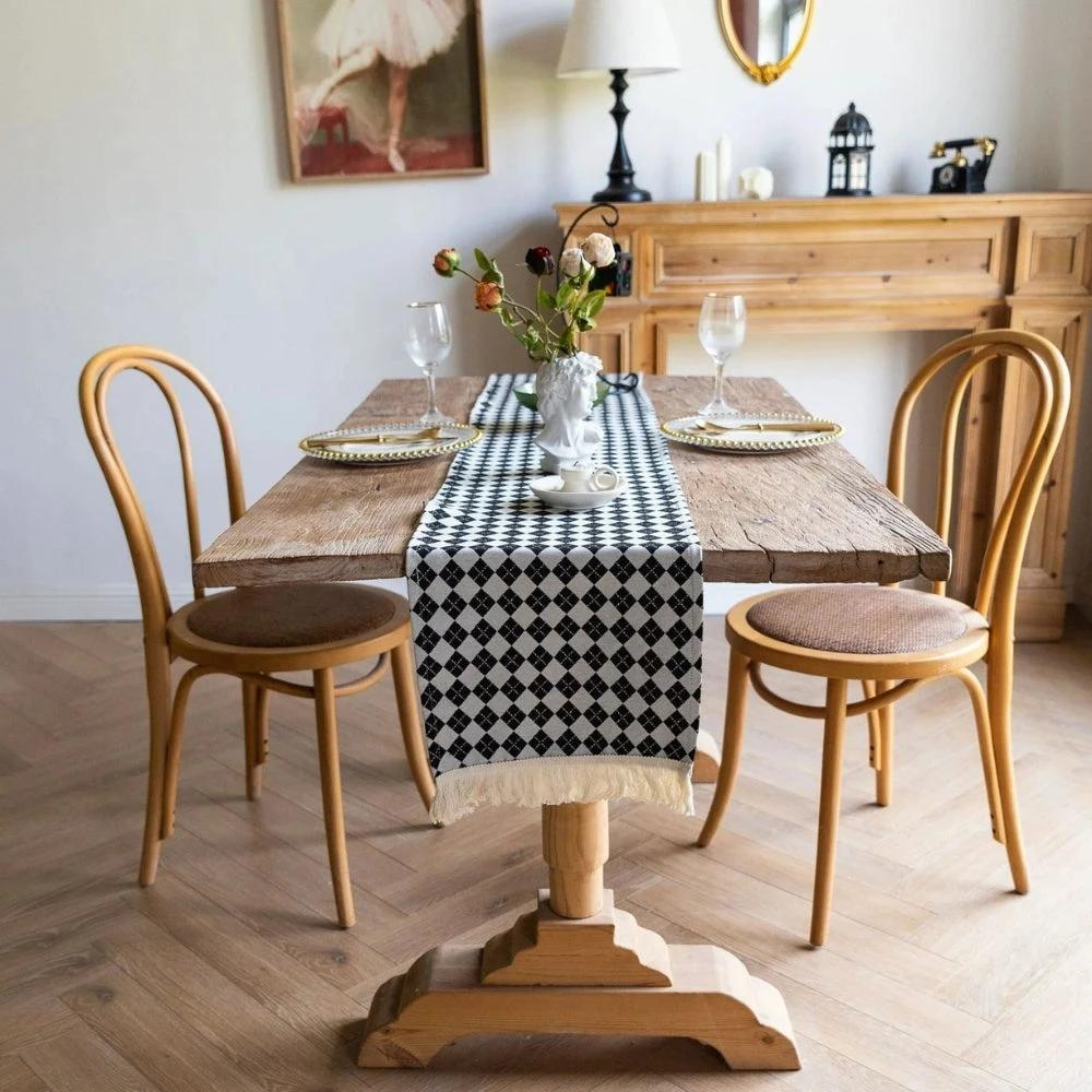 Tasseled Diamond Checkered Table Runner by Casa & Beyond