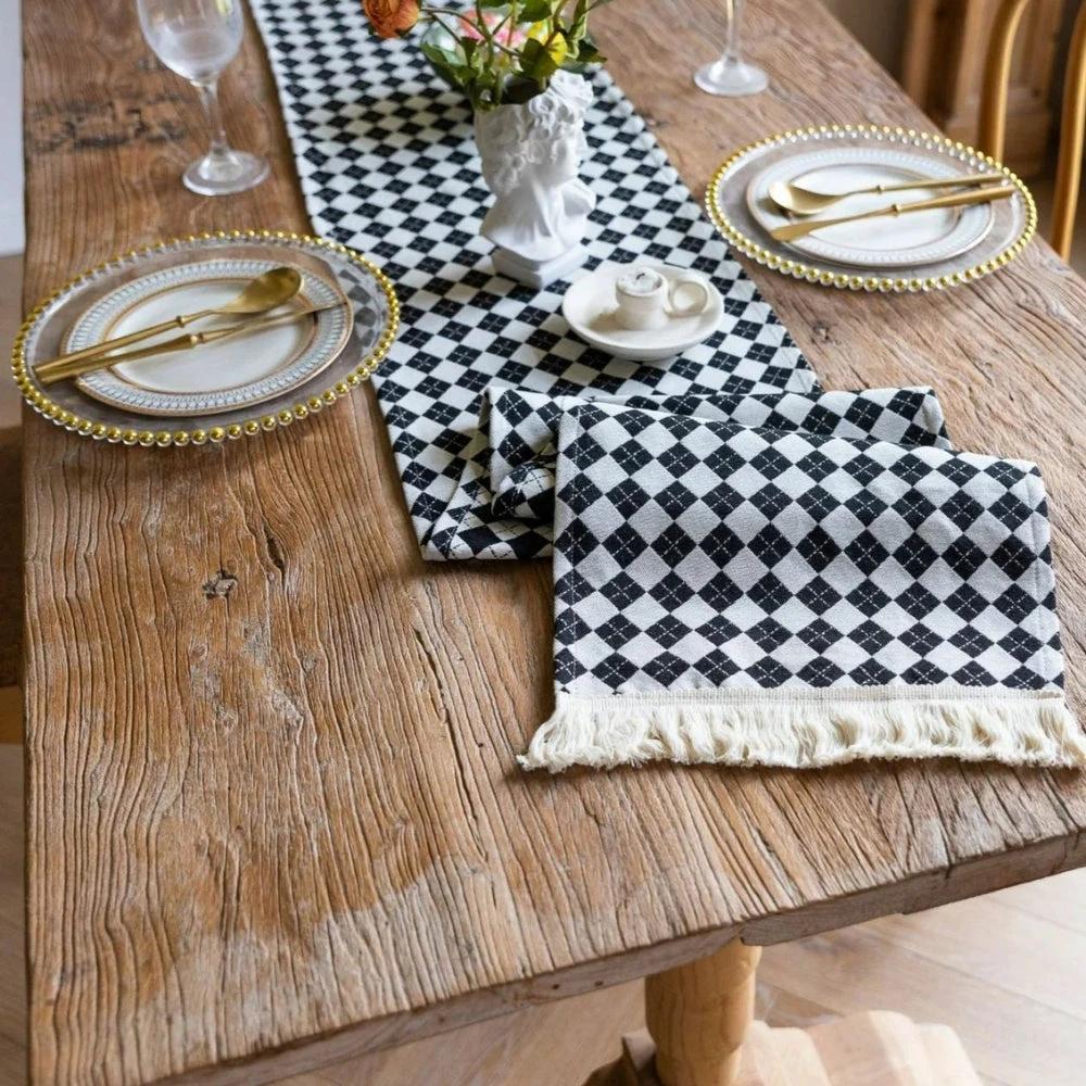 Tasseled Diamond Checkered Table Runner by Casa & Beyond