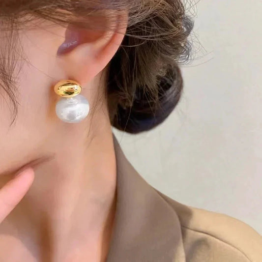 Classy Gold Accented Pearl Stud Earrings by BowLift