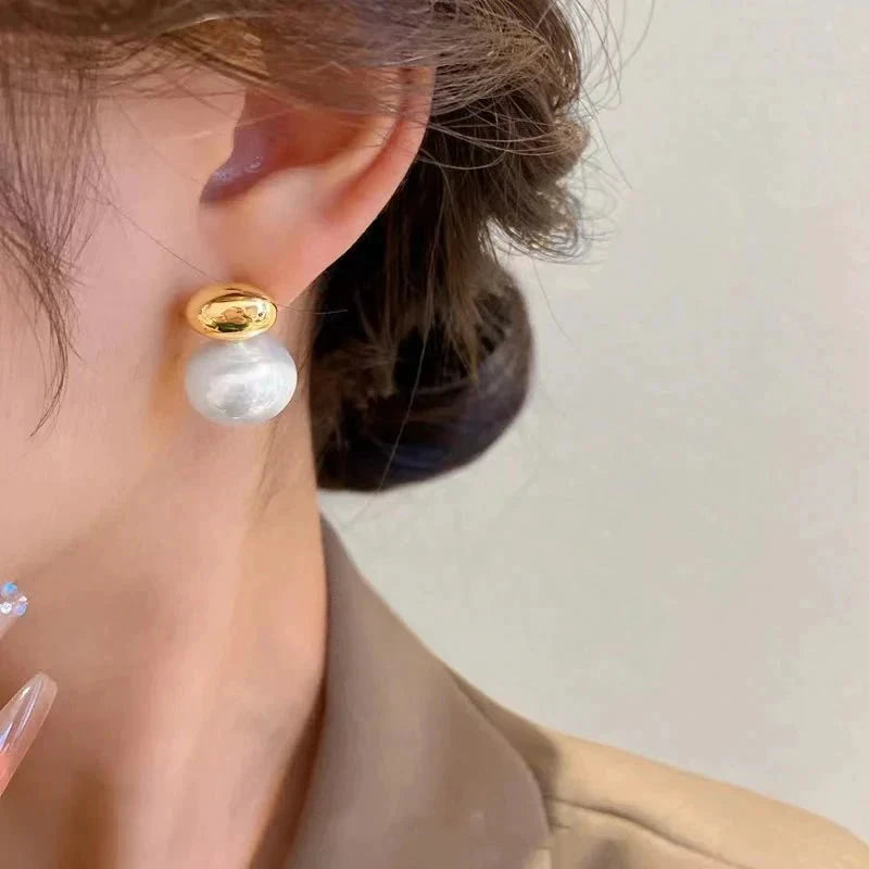 Classy Gold Accented Pearl Stud Earrings by BowLift