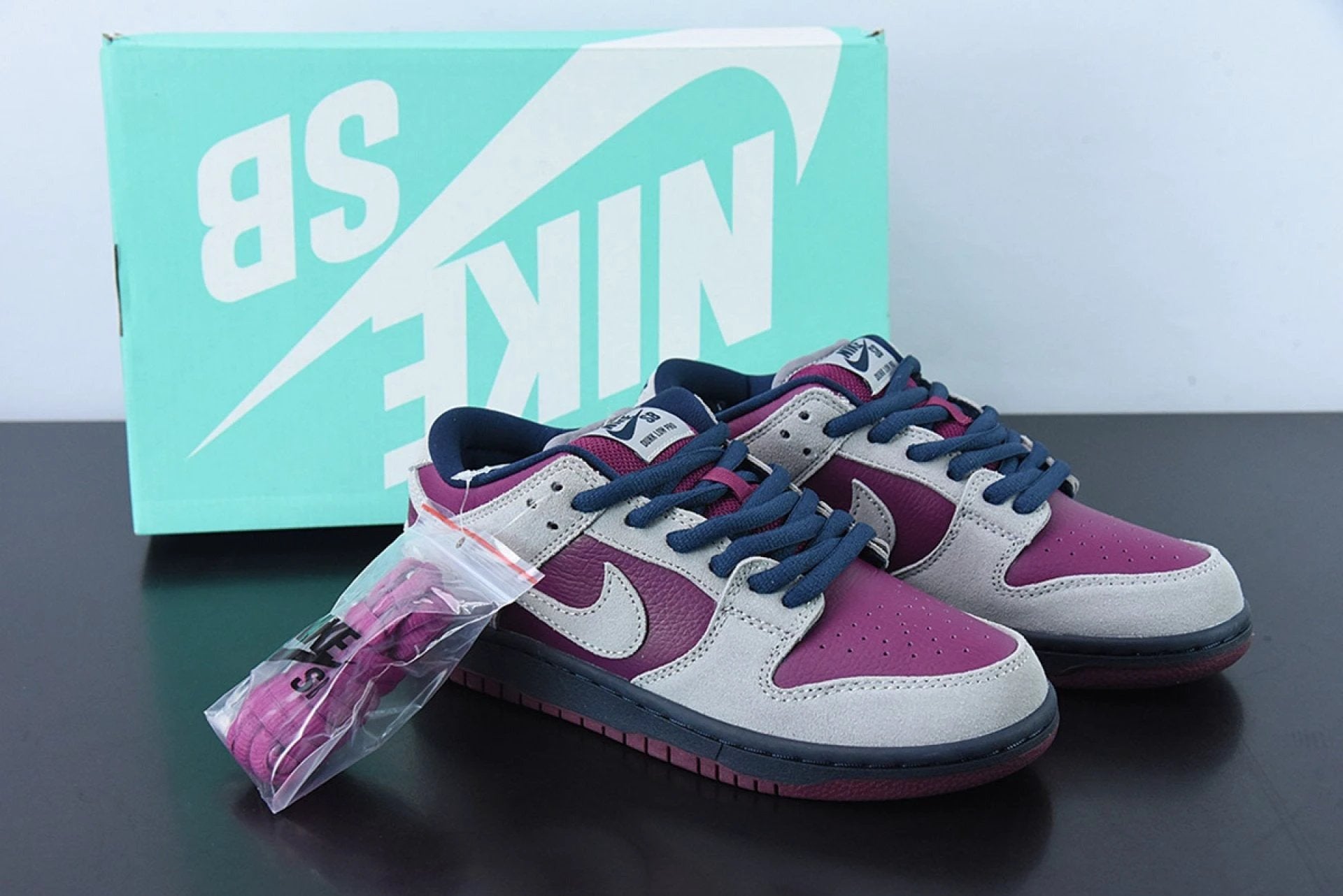SB Dunk Low Atmosphere Grey True Berry by Air Jordan