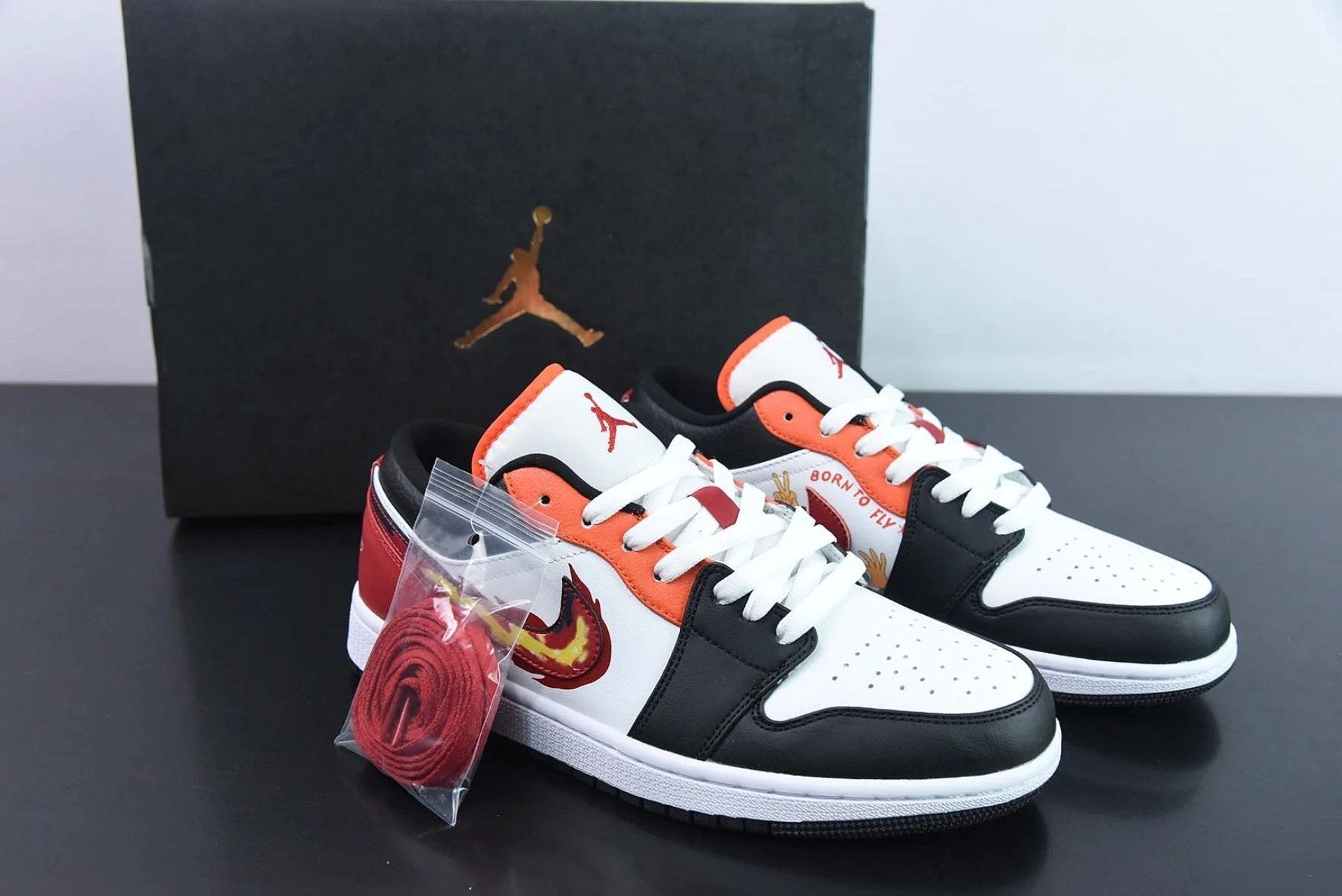 Air Jordan 1 Low GS Flaming Swoosh by Air Jordan