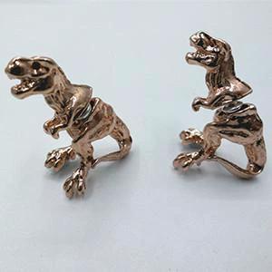 T-Rex Earrings by Bowlift